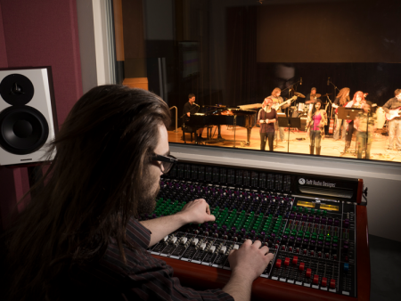 ACC student at the sound board in Waring Theater at the Littleton Campus.