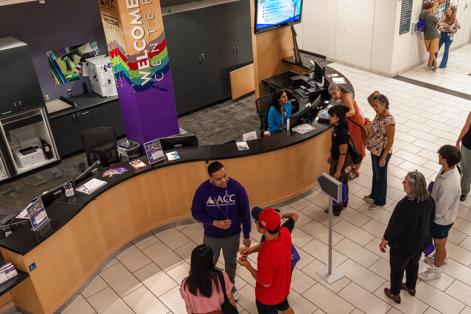 Students getting help at the Welcome Center at Littleton Campus