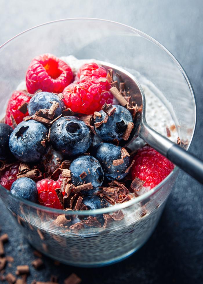 Berries, chocolate, and chia in a cup with a spoon - photo by Kate Blakeman