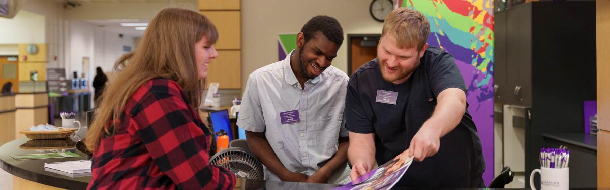 ACC Student Ambassadors assisting a student at the Welcome Center at the Littleton Campus.