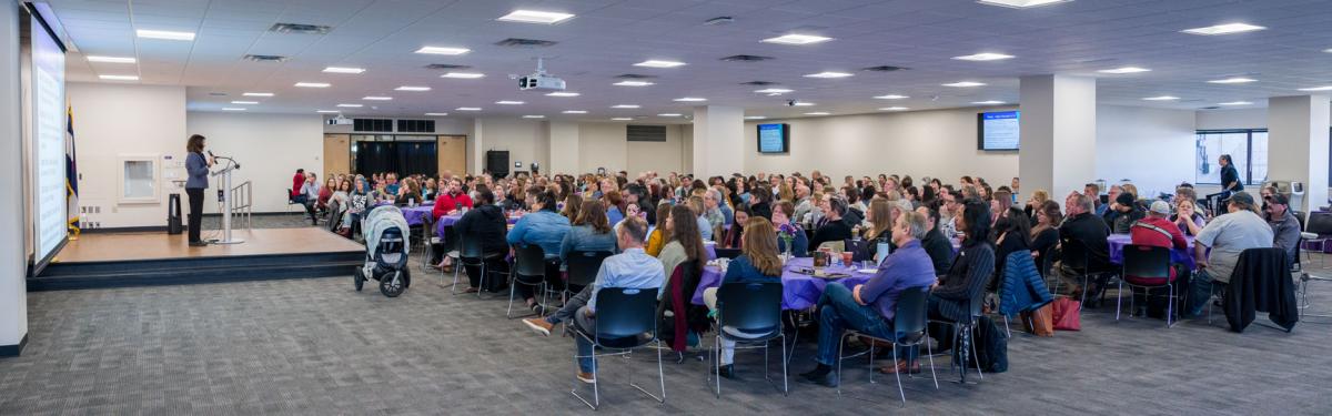 ACC staff and faculty sit for a presentation from ACC President Dr. Stephanie J. Fujii at BCC Week in the Summit Room at the Littleton Campus.