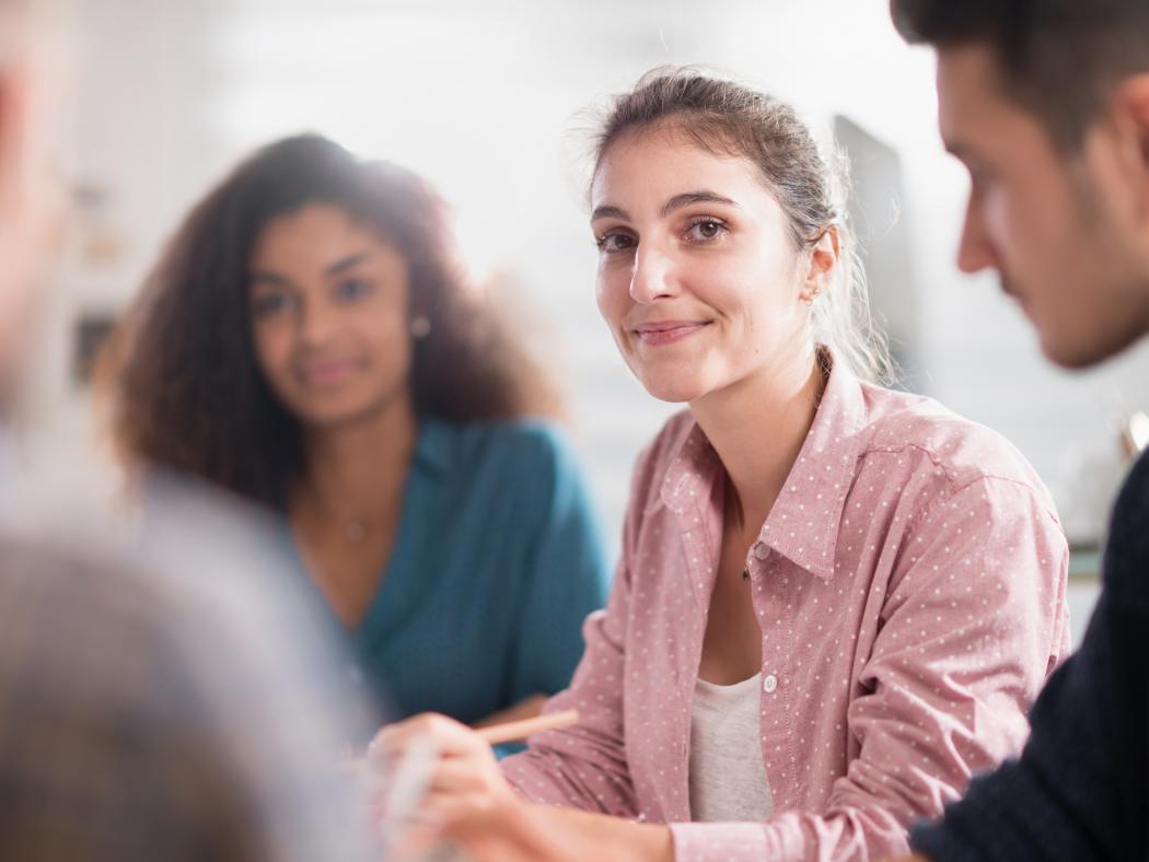 People sitting and sharing with one another during a discussion.