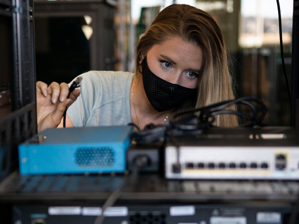 ACC Cybersecurity student - Kalyn (Cook) Cowdin working on servers at Sturm Collaboration Campus