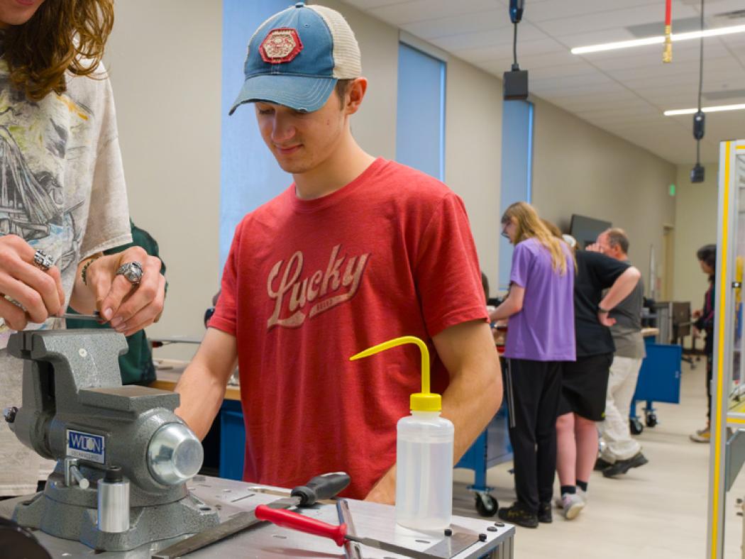 ACC student, Ian Williams, in Robotics and Automation Technology classroom at DCSD Legacy Campus in Lone Tree.