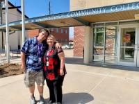 ACC Alumni Jesse Penton with his mom (and ACC Alumna and employee) in front of the Church Street building at the Littleton Campus