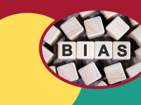 BIAS written on wooden blocks on a colorful background.