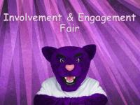 Summit, ACC's Puma mascot in front of purple curtain - Involvement & Engagement Fair