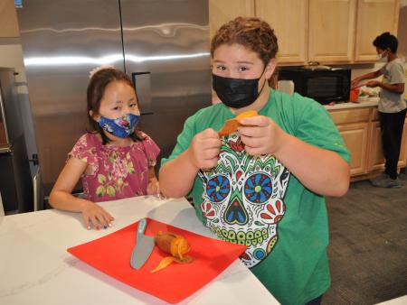 Middle school students in cooking class during an ACC Workforce & Community Programs Summer Youth Camp. 