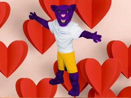 Summit (ACC's Puma Mascot) surrounded by big red hearts