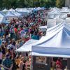 Tents of artists and works surrounded by attendees to the Affordable Arts Festival at ACC's Littleton Campus.