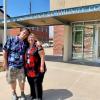 ACC Alumni Jesse Penton with his mom (and ACC Alumna and employee) in front of the Church Street building at the Littleton Campus