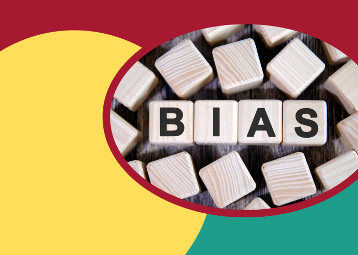 BIAS written on wooden blocks on a colorful background.