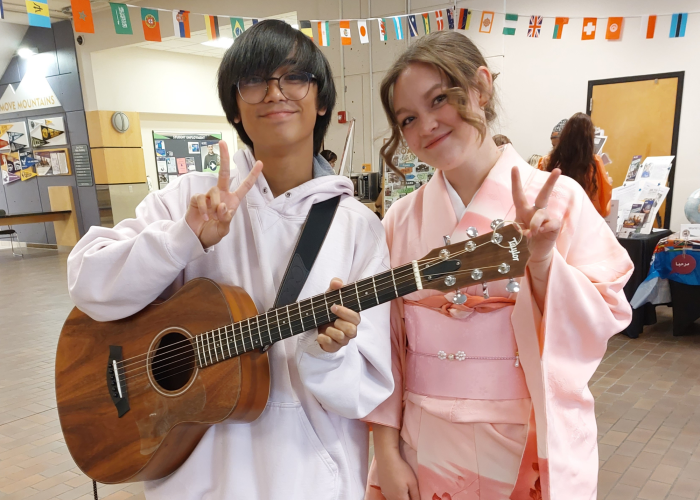 Two ACC students in the 2nd floor student lounge at the Littleton Campus celebrating international cultures.