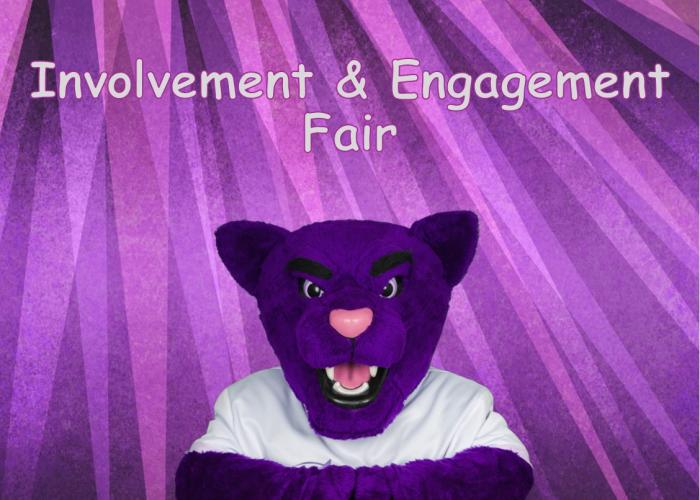 Summit, ACC's Puma mascot in front of purple curtain - Involvement & Engagement Fair